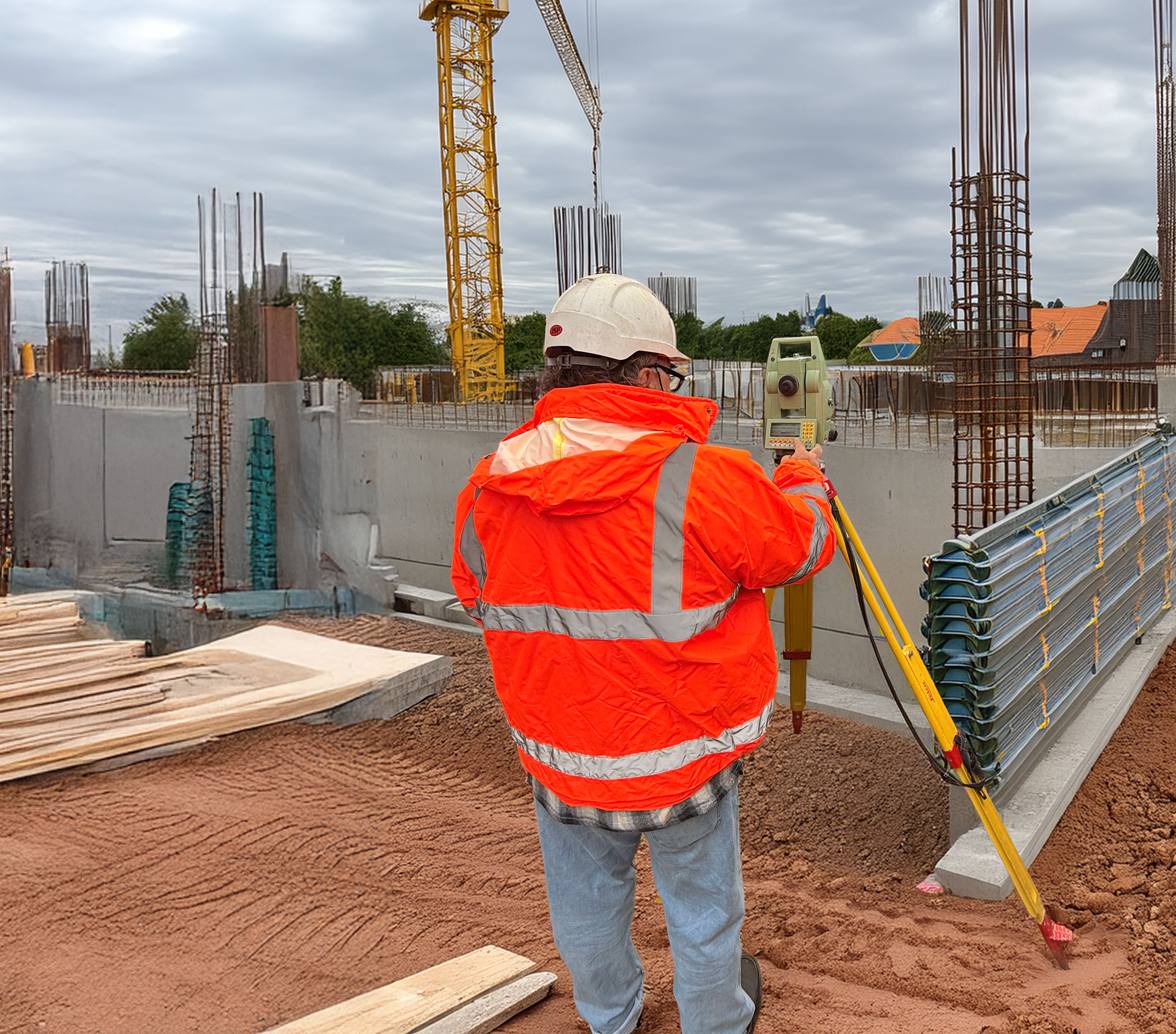 A setting out engineer carrying out his task